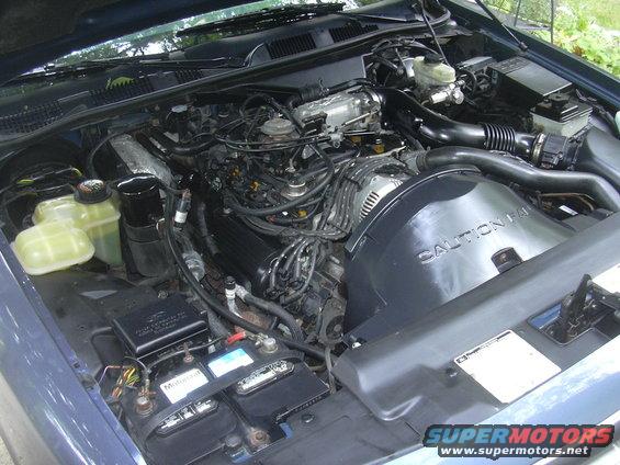 1996 Ford Crown Victoria engine bay with V8 engine and battery