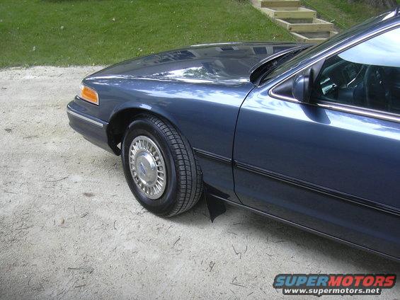 Blue 1996 Ford Crown Victoria front fender and wheel
