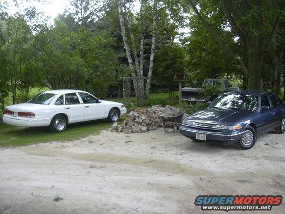 1996 Ford Crown Victoria sedans parked in yard