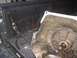 1978 Ford Bronco - A cracked transmission housing is shown secured in a truck bed, with a red arrow highlighting the damage.