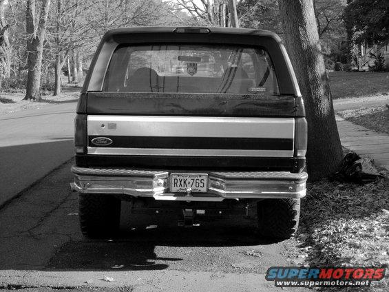 Rear view of a black 1994 Ford Bronco with a New Jersey license plate RXK-76S