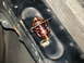 1998 Ford Crown Victoria - A close-up view of a vehicle's thermostat, showing its internal spring mechanism and brass seating.