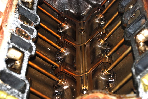 Engine intake manifold with copper-colored pushrods