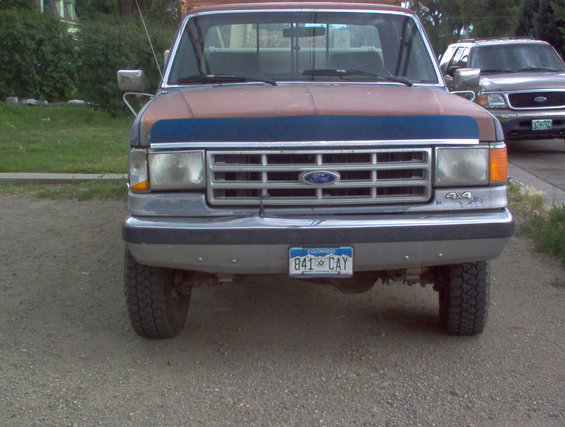 Front view of a 1993 Ford F-Series truck with a blue grille and Colorado license plate 841 CAY