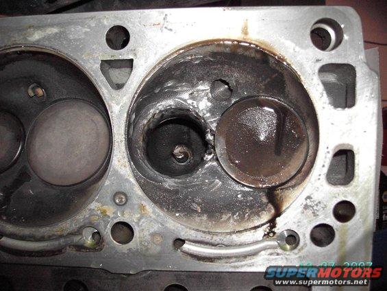 ..and causing the valve to whack the piston and break off..