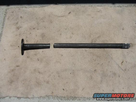 Broken axle shaft with a flange on one end and splines on the other
