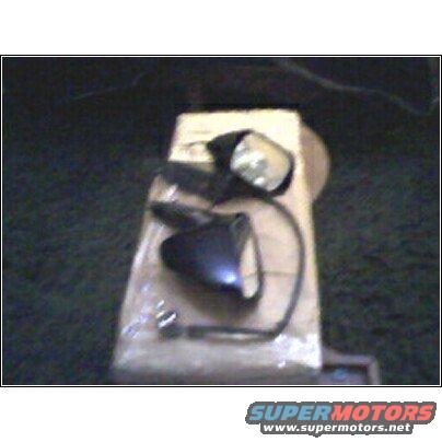 two black car side mirrors on a cardboard box