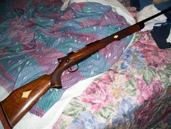 Wooden rifle with diamond inlays on stock and forend