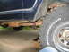 1978 Ford Bronco - Close-up of the rear axle and exhaust system on a 1978 Ford Bronco.