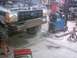 1990 Ford Ranger - A Ford truck is in a workshop with its hood up and a custom bumper being fabricated and welded onto the front.