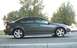 2005 Mazda 6 - This 2005 Mazda 6 sedan is captured from its side profile, highlighting its design and rear spoiler.