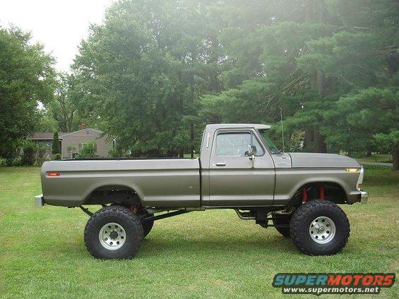 Gray 1979 Ford F-150 pickup truck, lifted with large tires, side view