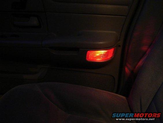 Installed light behind door reflector