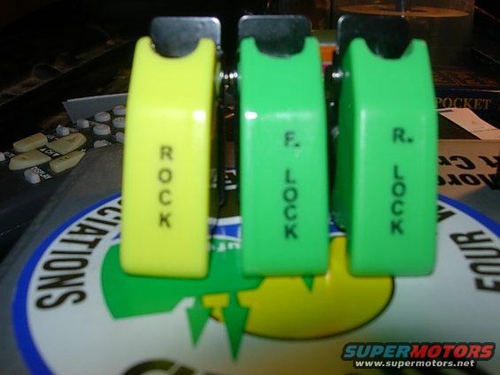Yellow, green, and green switches labeled ROCK, F. LOCK, and R. LOCK