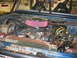 1992 Ford Mustang - Engine bay of a 1974 Ford Bronco, modified with a roll cage and aftermarket air intake.