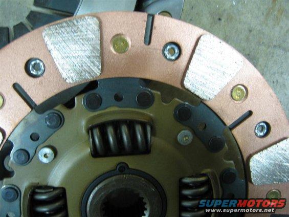 006_pucks.jpg Puck type friction material-flywheel side