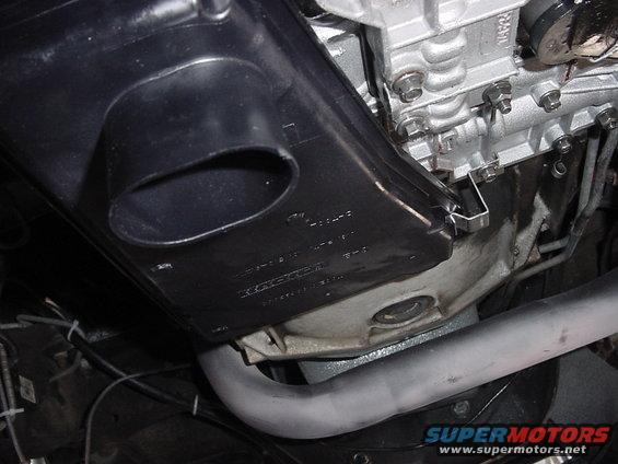 Underbody view of vehicle exhaust pipe and engine components