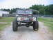 1992 Ford Mustang - This modified Ford Bronco features oversized tires and a winch, indicating it is built for off-road use.