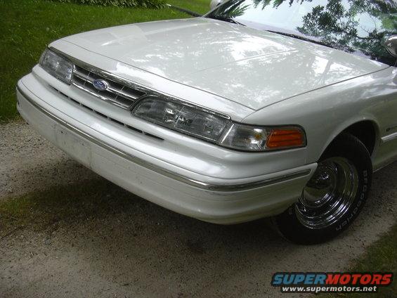 1997 Ford Crown Victoria front end with chrome grille and bumper