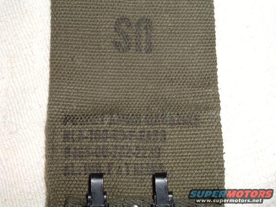Green canvas strap with US marking and metal clasps