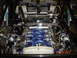 1993 Ford Taurus - Custom engine bay features a blue intake manifold and chrome piping, with a date stamp from 2003.