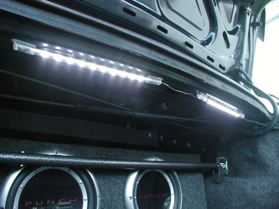 Trunk interior with LED strip lights and two Rockford Fosgate Punch subwoofers
