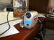 1996 Ford Probe - A Sony Handycam camcorder sits on a desk next to papers and a jar of pretzels.