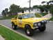 1984 Ford Bronco - Modified 1973 Ford F-Series pickup truck with racing livery and off-road tires.
