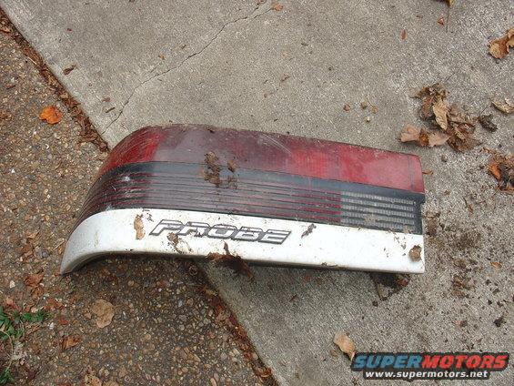 Ford Probe taillight on concrete with leaves