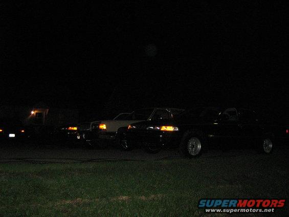1988 Mercury Grand Marquis and other cars parked at night
