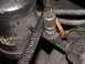 1987 Lincoln Town Car - Vacuum hose connection with a small copper line, likely part of an engine system.