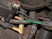 1987 Lincoln Town Car - A close-up view of various vacuum lines and electrical connectors within a vehicle's engine compartment.