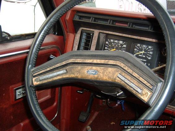 1986 Ford Bronco interior with woodgrain trim and gauges