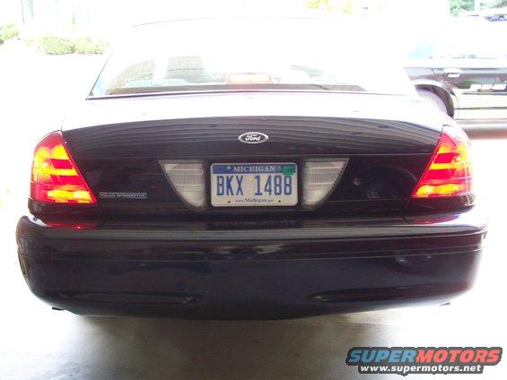Dark blue 2003 Ford Crown Victoria Police Interceptor rear view with Michigan license plate BKX 1488