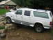 1992 Ford Mustang - This extended cab SUV appears to be from the early to mid-1990s, possibly a Ford Bronco or similar model, shown off-road.
