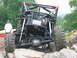 1992 Ford Mustang - Custom buggy with extreme suspension and large off-road tires on a challenging rock course.
