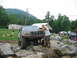 1992 Ford Mustang - A man poses with a lifted Ford Bronco navigating a rocky terrain.