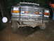 1992 Ford Mustang - A Ford F-Series truck navigates a rocky, off-road trail.