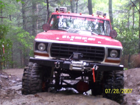 1979 Ford F-150 modified for off-roading, front view in muddy terrain