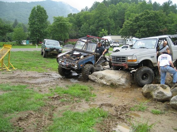 1995 Ford Bronco and Ford F-Series truck on rocky terrain