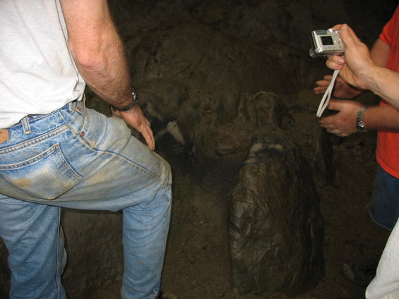 Cave formation with people photographing it