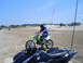 1994 Ford F-250 - Two off-road vehicles, a dirt bike and an ATV, are parked on sandy terrain under a clear blue sky.