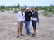 1994 Ford F-250 - Three women pose for a photo on a sandy beach with dunes and the ocean in the distance.