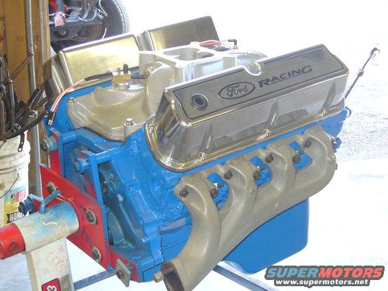 Ford Racing V8 engine on a stand, blue block, chrome valve covers