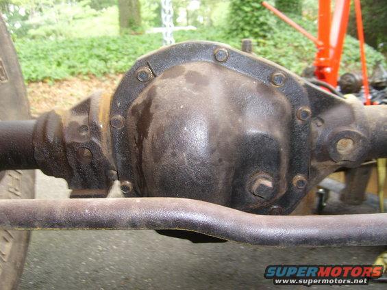 Rear differential assembly with visible bolts and a tie rod