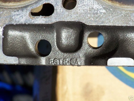 Cast iron engine cylinder head with E8TE-DA casting marks