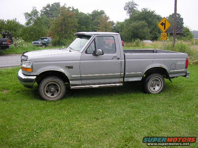 Gray 1994 Ford F-150 pickup truck, side view
