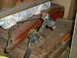 2005 Ford Excursion - A black suspension part is shown resting on a wooden surface, with other items in the background.