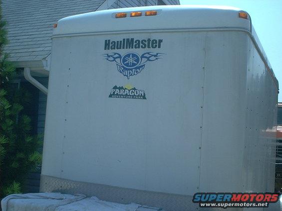 White trailer with HaulMaster Raptor and Paragon Adventure Park logos