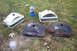 1968 Ford Mustang - Several car headlight buckets, some appearing to be new or refinished, sit on the grass next to a can of spray paint.